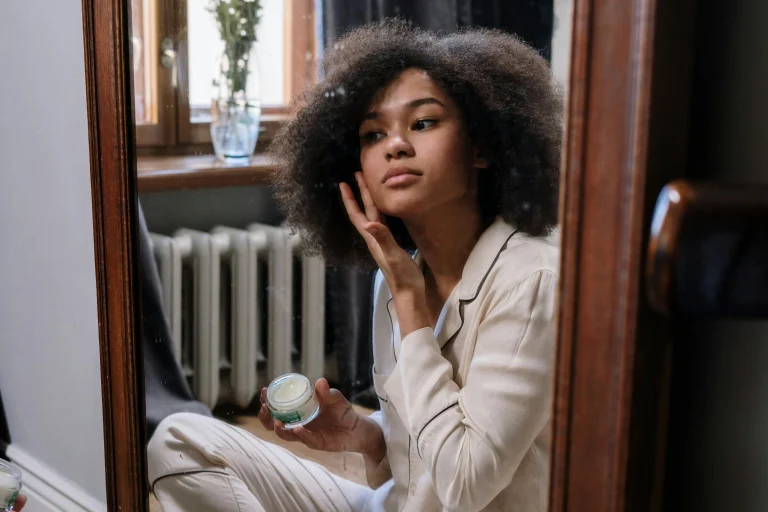 Portable summer wellness essentials including handheld mini fan, travel water filter, and sunscreen for on-the-go hydration and sun care